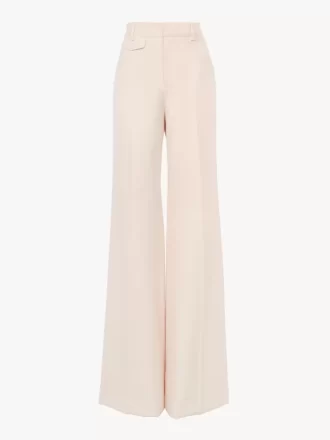 High-rise flared pants in wool gabardine