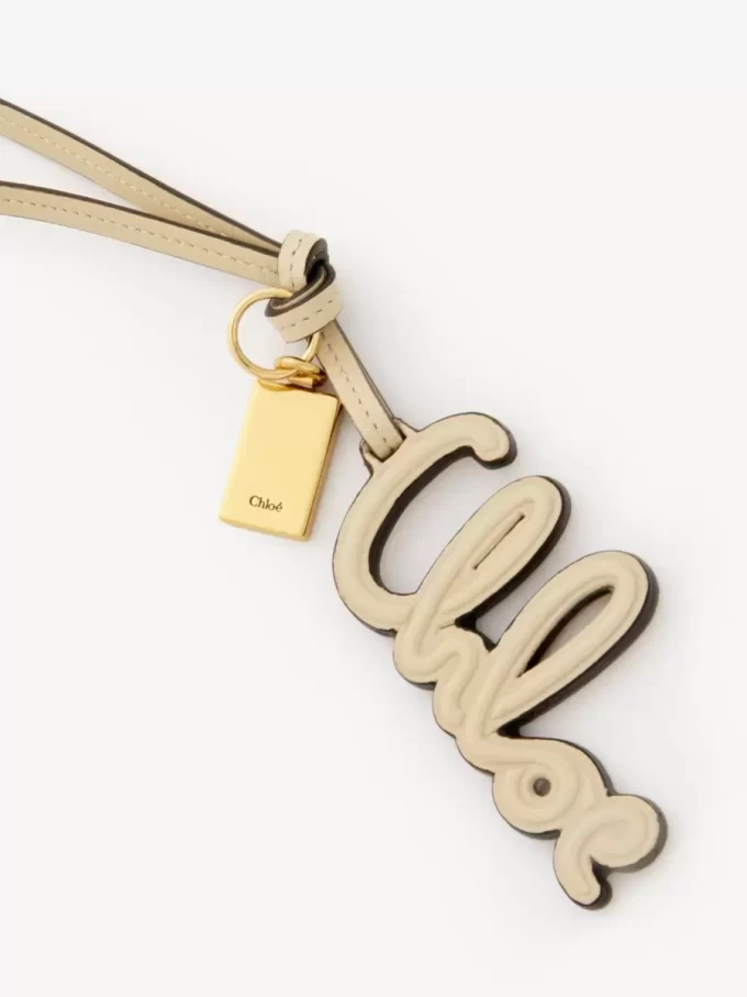 Logo bag charm in shiny leather