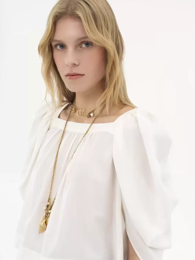 Puff-sleeve pleated top in silk poplin