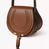 Small Marcie saddle bag in shiny leather