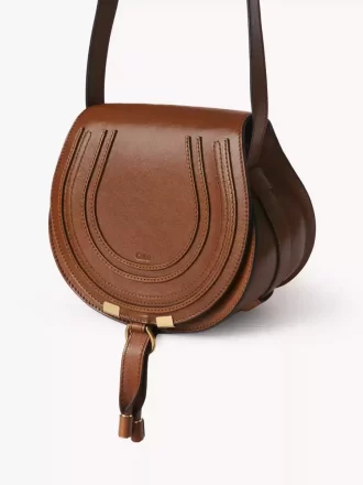 Small Marcie saddle bag in shiny leather