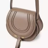 Small Marcie saddle bag in shiny leather