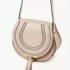 Small Marcie saddle bag in shiny leather