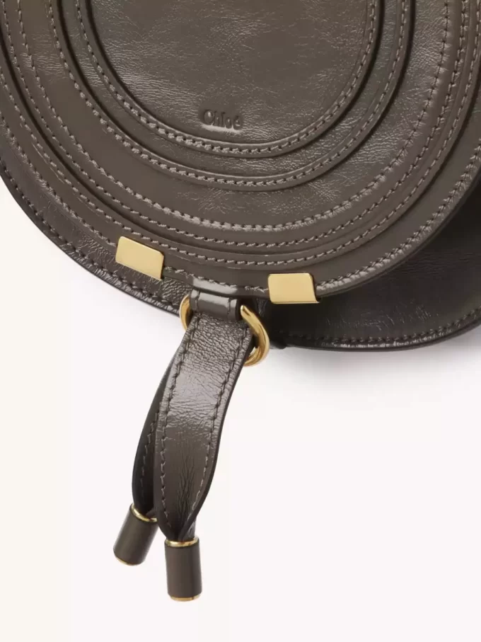 Small Marcie saddle bag in shiny leather