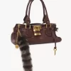 The Treasure Tails charm in shearling